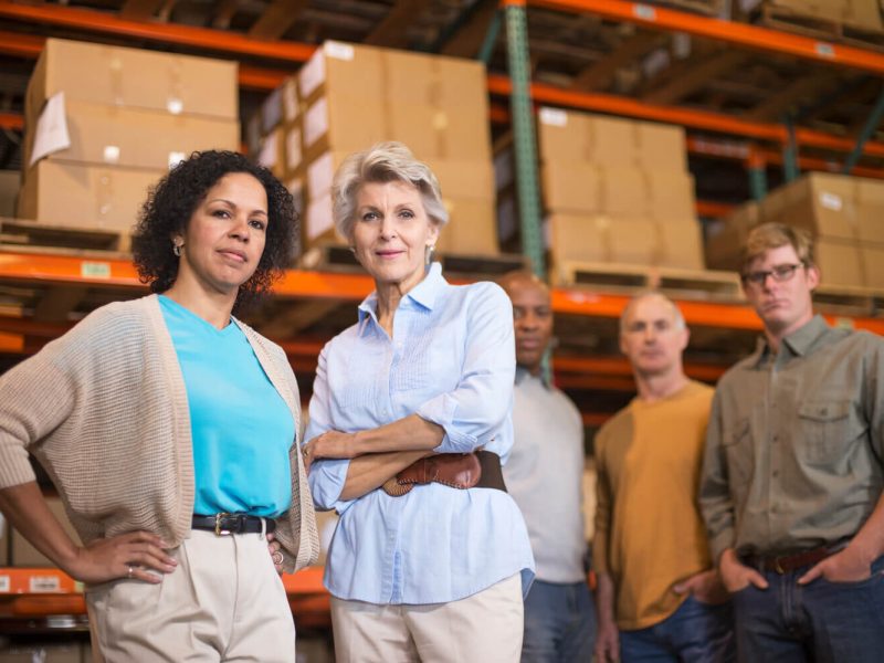 portrait-of-warehouse-workers-in-front-of-boxes-2022-03-04-01-52-01-utc